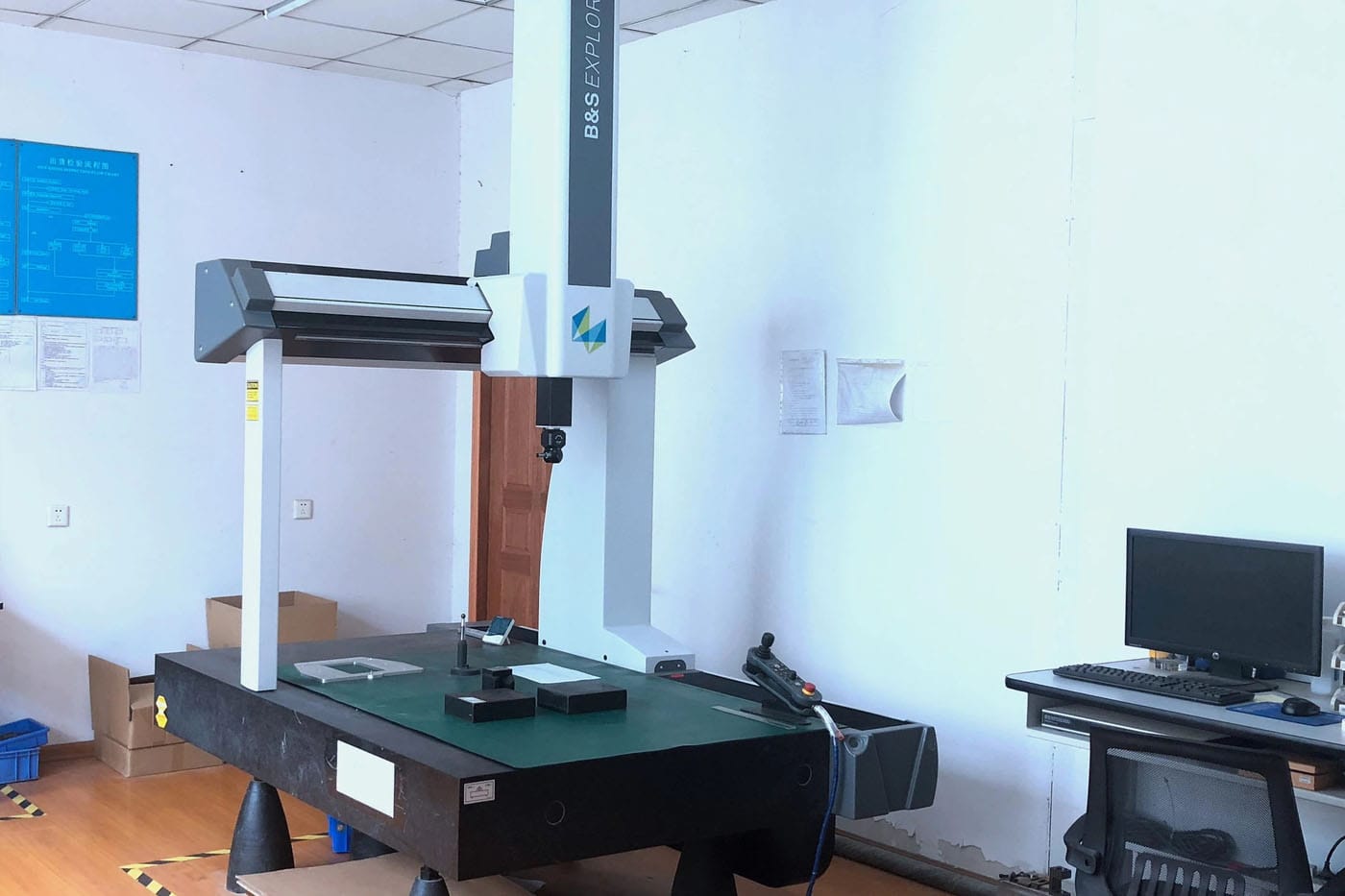 CMM coordinate measuring machine probing a precision-machined PEEK plastic component at PlasticPartsCustom.
